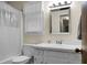 Bathroom with white vanity, shower/tub and window at 1219 Edward Dr, Moncks Corner, SC 29461
