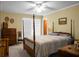 Bedroom with four-poster bed and wooden dresser at 1219 Edward Dr, Moncks Corner, SC 29461