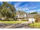 Ranch style brick home with a red door and attached two-car garage at 1219 Edward Dr, Moncks Corner, SC 29461