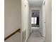 Long hallway with carpeted floor and neutral-colored walls at 1219 Edward Dr, Moncks Corner, SC 29461