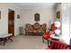 Living room features antique furniture and a neutral color palette at 1219 Edward Dr, Moncks Corner, SC 29461