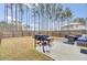 Large backyard with wood fence and grill at 155 Surfbird Rd, Summerville, SC 29486