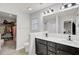 Modern bathroom with double vanity, walk-in shower, and large closet at 155 Surfbird Rd, Summerville, SC 29486