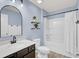 Bathroom with a white tub and shower, and dark brown vanity at 155 Surfbird Rd, Summerville, SC 29486