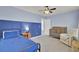 Blue bedroom with crib and twin bed, blue walls and dark blue accent wall at 155 Surfbird Rd, Summerville, SC 29486