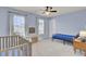 Light blue bedroom with crib and twin bed at 155 Surfbird Rd, Summerville, SC 29486