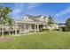 Clubhouse with a manicured lawn and a sidewalk lined with shrubs leading up to it at 155 Surfbird Rd, Summerville, SC 29486