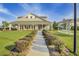 Clubhouse with a manicured lawn and a sidewalk lined with shrubs leading up to it at 155 Surfbird Rd, Summerville, SC 29486