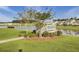 Scenic community deck overlooking a tranquil pond, providing a serene outdoor gathering space at 155 Surfbird Rd, Summerville, SC 29486