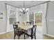 Bright dining room with four chairs and sliding glass doors at 155 Surfbird Rd, Summerville, SC 29486