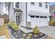 Two-story home with white siding, landscaped yard, and attached garage at 155 Surfbird Rd, Summerville, SC 29486