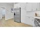 Stainless steel refrigerator in a kitchen with white cabinets at 155 Surfbird Rd, Summerville, SC 29486