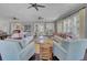 A welcoming living room area featuring ceiling fans, modern furniture, and plenty of natural light at 155 Surfbird Rd, Summerville, SC 29486
