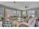 Bright lounge with cozy seating, large windows, and a view of the community pool at 155 Surfbird Rd, Summerville, SC 29486
