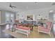Stylish lounge featuring comfortable seating, a pass-through window to kitchen, and bright decor at 155 Surfbird Rd, Summerville, SC 29486