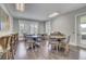 Community gathering room with round tables, wood floors and neutral walls for comfortable use at 155 Surfbird Rd, Summerville, SC 29486