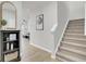 Carpeted staircase with a view of the living room at 155 Surfbird Rd, Summerville, SC 29486