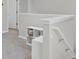 Upstairs hallway with white walls and carpeted flooring at 155 Surfbird Rd, Summerville, SC 29486