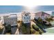 Aerial view of three oceanfront homes at 1681 E Ashley Ave # A & B, Folly Beach, SC 29439