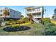 Elevated home with a landscaped backyard and two-story design at 1681 E Ashley Ave # A & B, Folly Beach, SC 29439