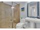 Clean bathroom with glass shower and pedestal sink at 1681 E Ashley Ave # A & B, Folly Beach, SC 29439