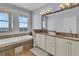 Elegant bathroom with double vanity, soaking tub, and ocean view at 1681 E Ashley Ave # A & B, Folly Beach, SC 29439