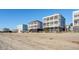Multiple beach houses on a sandy shore at 1681 E Ashley Ave # A & B, Folly Beach, SC 29439