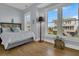 Bedroom with hardwood floors, large windows, and a view at 1681 E Ashley Ave # A & B, Folly Beach, SC 29439