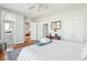 Main bedroom with ocean view, access to balcony, and hardwood floors at 1681 E Ashley Ave # A & B, Folly Beach, SC 29439