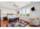 Bright bedroom with hardwood floors, a ceiling fan, and ocean views at 1681 E Ashley Ave # A & B, Folly Beach, SC 29439