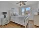 Bedroom with hardwood floors, a ceiling fan, and views from a window at 1681 E Ashley Ave # A & B, Folly Beach, SC 29439