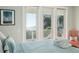 Bedroom with ocean view and orange chair at 1681 E Ashley Ave # A & B, Folly Beach, SC 29439