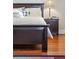 Main bedroom with dark wood furniture and a striped comforter at 1681 E Ashley Ave # A & B, Folly Beach, SC 29439