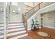 Grand entryway with hardwood floors, a circular inlay, and a staircase at 1681 E Ashley Ave # A & B, Folly Beach, SC 29439