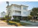 Two-story beach home with a green roof and attached garage at 1681 E Ashley Ave # A & B, Folly Beach, SC 29439
