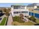 Two-story beach house with green roof and balcony at 1681 E Ashley Ave # A & B, Folly Beach, SC 29439