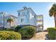 Two story home, light blue exterior, elevated, ocean view at 1681 E Ashley Ave # A & B, Folly Beach, SC 29439