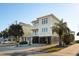 Two-story beach home with a green roof and attached garage at 1681 E Ashley Ave # A & B, Folly Beach, SC 29439