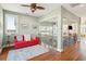 Open upper hallway with hardwood floors, and a pineapple chandelier at 1681 E Ashley Ave # A & B, Folly Beach, SC 29439
