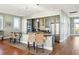 Open kitchen with island, stainless steel appliances, and hardwood floors at 1681 E Ashley Ave # A & B, Folly Beach, SC 29439