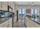 Bright kitchen with stainless steel appliances and ocean views at 1681 E Ashley Ave # A & B, Folly Beach, SC 29439