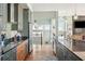 Open kitchen with granite countertops and a view to the living area at 1681 E Ashley Ave # A & B, Folly Beach, SC 29439