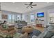 Bright living room with ocean views, comfy sofas, and wicker chairs at 1681 E Ashley Ave # A & B, Folly Beach, SC 29439