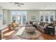 Spacious living room with hardwood floors, sectional sofa, and ocean views at 1681 E Ashley Ave # A & B, Folly Beach, SC 29439