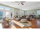 Spacious living room with hardwood floors, comfortable seating, and ocean views at 1681 E Ashley Ave # A & B, Folly Beach, SC 29439