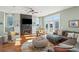 Living room features a fireplace, hardwood floors, and comfortable seating at 1681 E Ashley Ave # A & B, Folly Beach, SC 29439