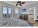 Main bedroom with ocean views, a large bed, and en-suite bathroom at 1681 E Ashley Ave # A & B, Folly Beach, SC 29439