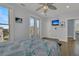 Main bedroom with hardwood floors, a large bed, and ocean views at 1681 E Ashley Ave # A & B, Folly Beach, SC 29439