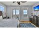 Main bedroom with ocean views, a large bed, and plenty of natural light at 1681 E Ashley Ave # A & B, Folly Beach, SC 29439