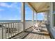 Oceanfront balcony with rocking chair at 1681 E Ashley Ave # A & B, Folly Beach, SC 29439